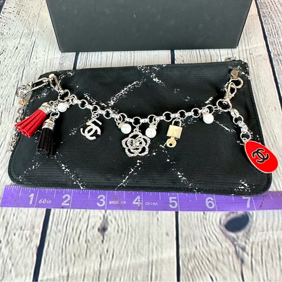 CHANEL black nylon pouch crossbody with chain, bag charm and authenticit⦠- Picture 11 of 12